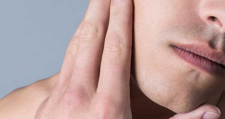 A man's face with no shaving irritation