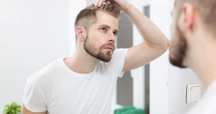Man wondering how to shave head with a razor
